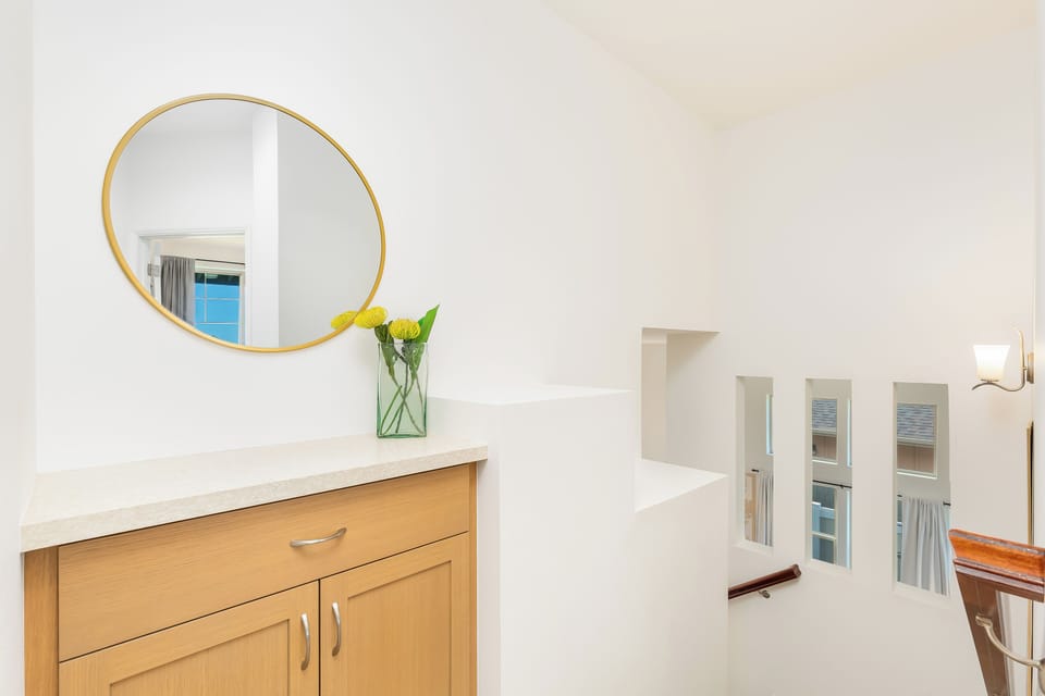 Upstairs hallway connecting the two cozy bedrooms