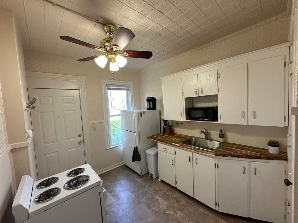 Prepare and cook your favorite meal in this compact kitchen.