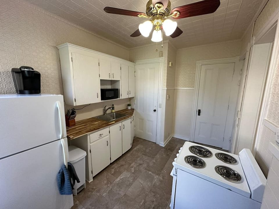 Prepare and cook your favorite meal in this compact kitchen.
