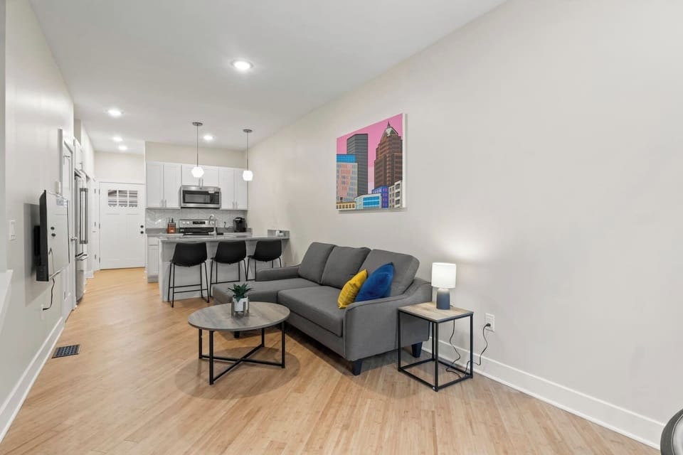 Our beautifully designed open-concept kitchen and living room is the heart of the home, offering the perfect space for family and friends to gather and relax