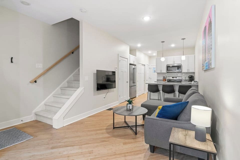 Our beautifully designed open-concept kitchen and living room is the heart of the home, offering the perfect space for family and friends to gather and relax