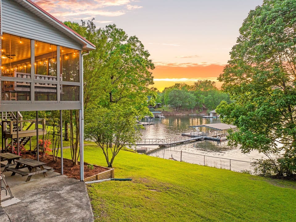Take in a sunset on Smith lake from the Dock, Covered Patio or fully fenced yard