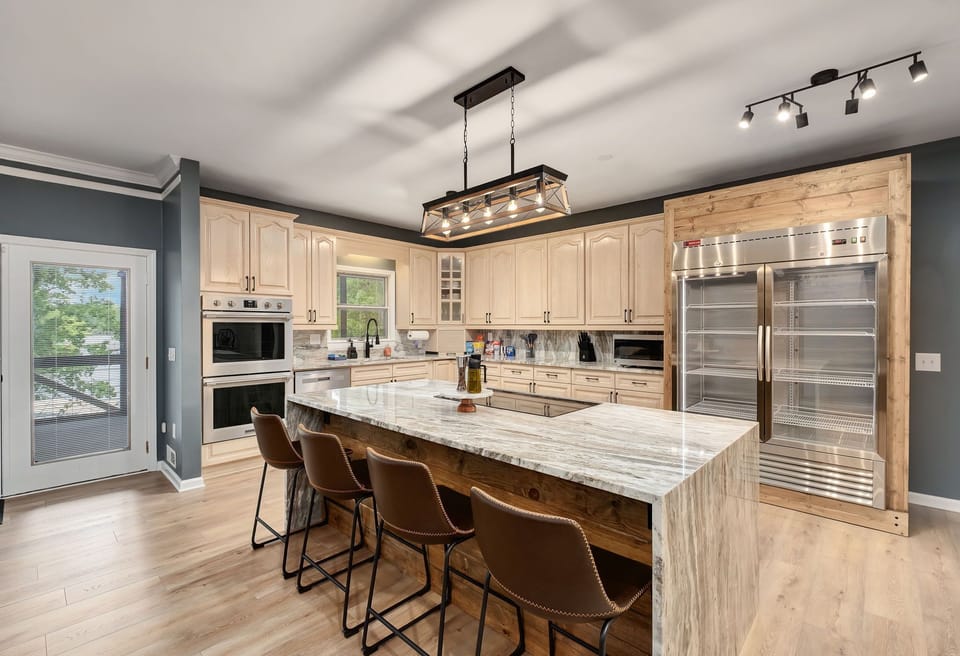 A true Chef's kitchen! Double Oven, 54" Fridge, Induction Range & Pro Ice Maker