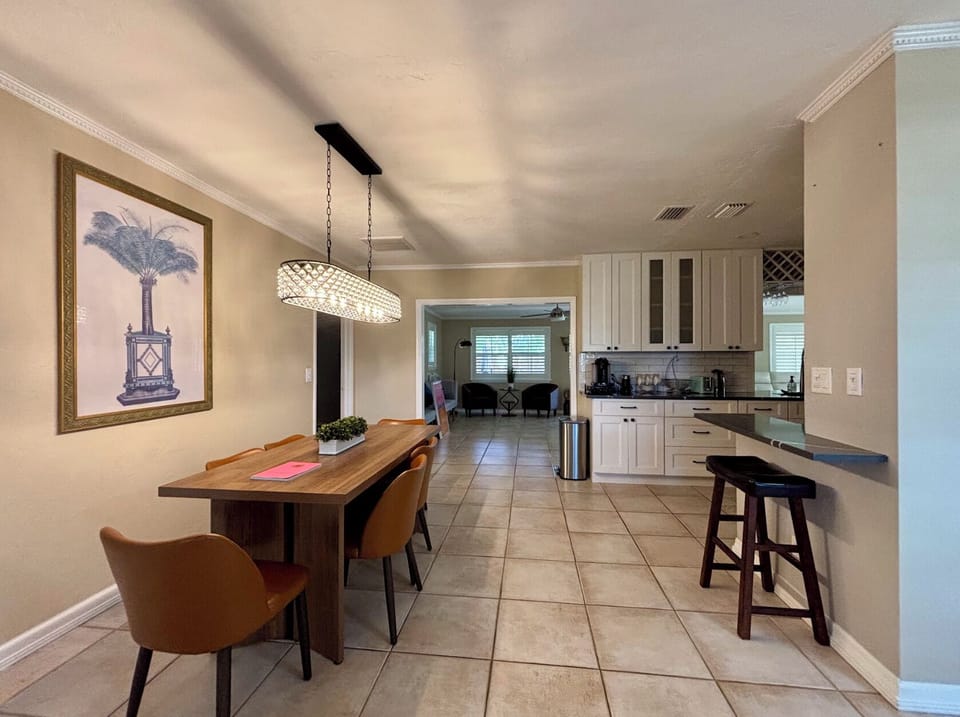 Gather around the table for family meals and games while enjoying the "Old Florida" palm.