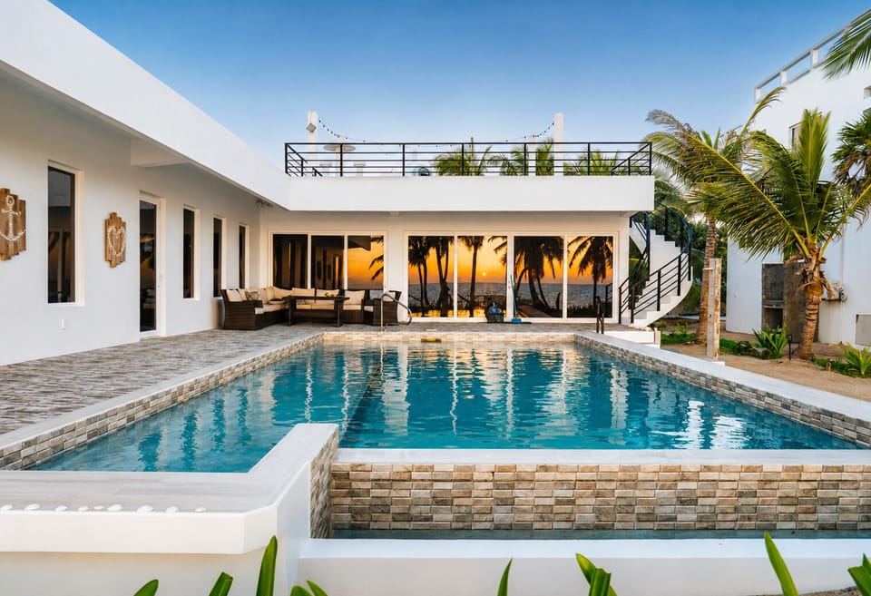 Modern Beachfront Villa with Sunset Reflections & Rooftop Terrace