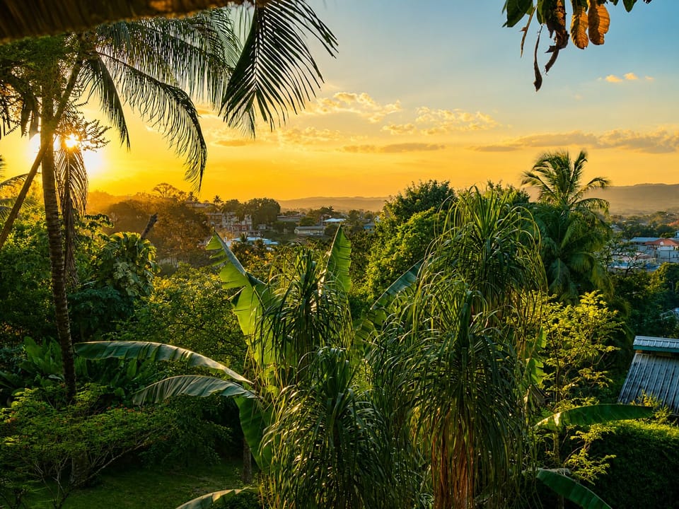 Enjoy breathtaking sunset views over the Belize jungle from Villa Attalea's private hillside location.