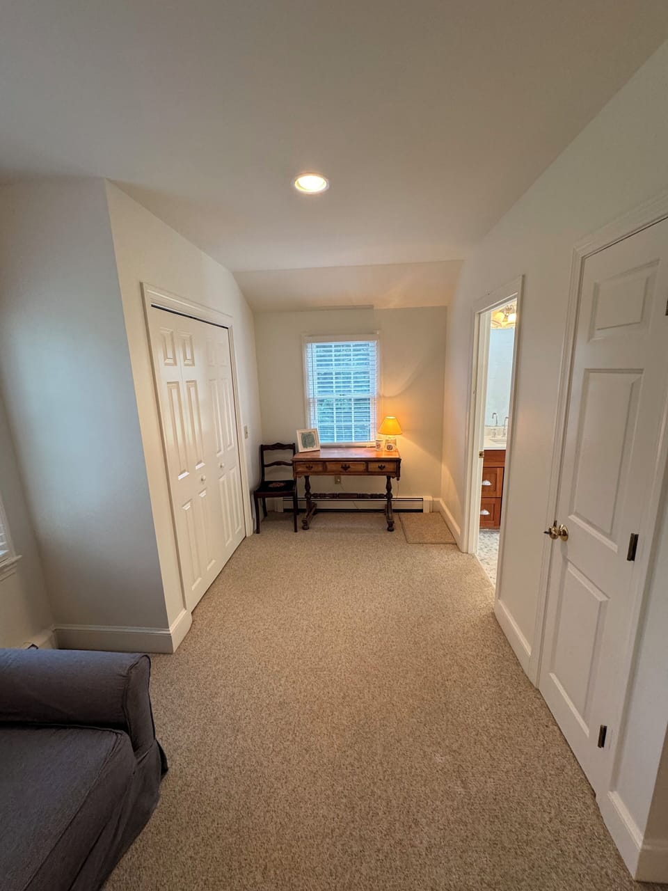 Desk and closets in Primary BR. Fully renovated bath to the back right.