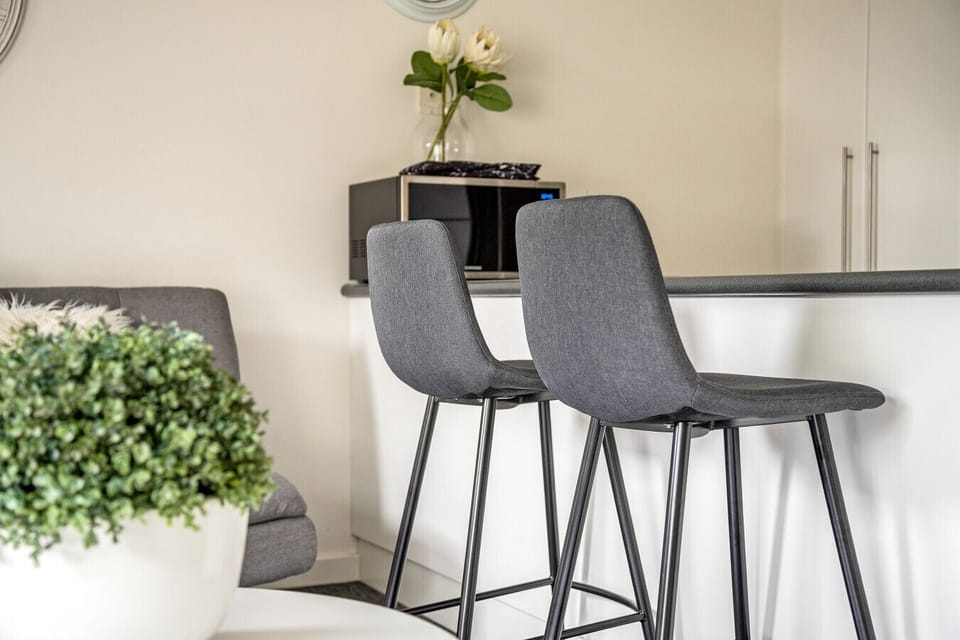 Kitchen bar with two stools — a casual dining option
