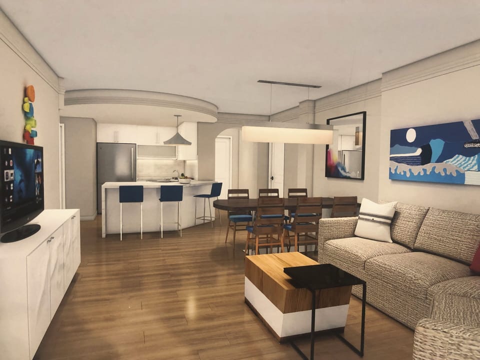 Living room with sofa bed and full kitchen.