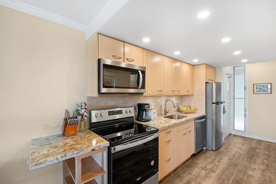 Enjoy cooking at your fully furnished kitchen with stainless steel appliances