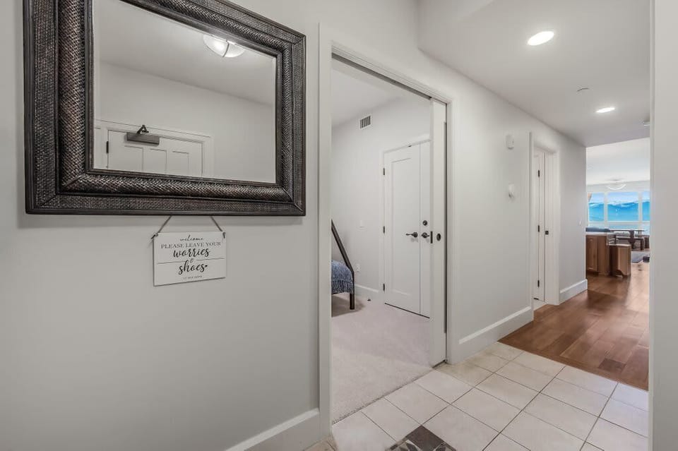 Walking into the condo and looking down the hallway