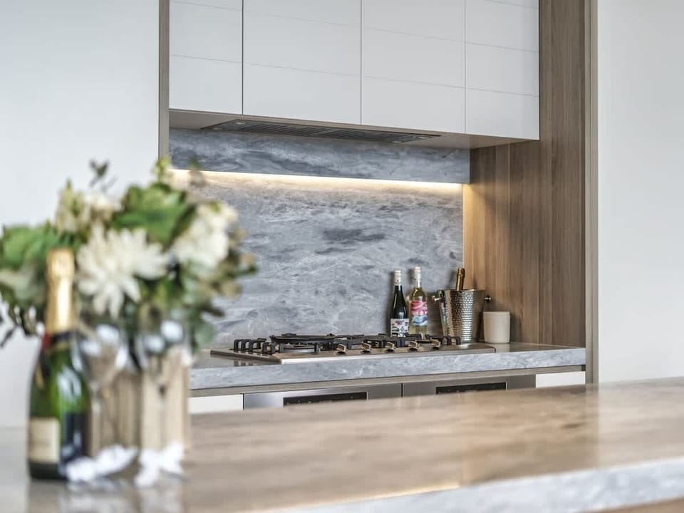 Expansive kitchen counter, offering plenty of space for meal prep and entertaining