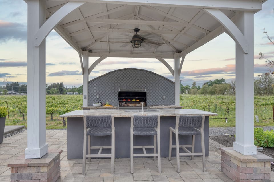 Covered outdoor bar with ceiling fan – entertaining made easy.
