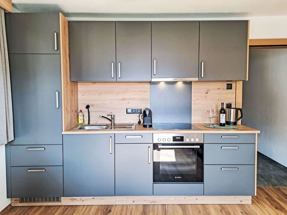 Kitchen, Cabinetry, Kitchen Appliance, Furniture, Countertop, Flooring, Major Appliance, Wood, Interior Design, Cupboard