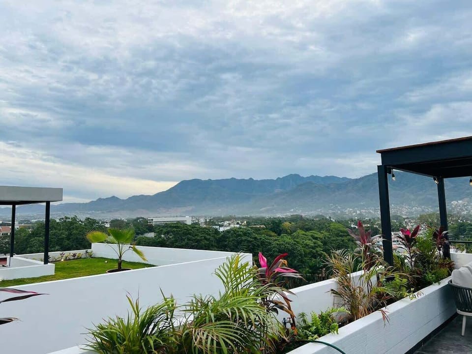 A beautiful mountainview rooftop pool and lounge at the condo complex