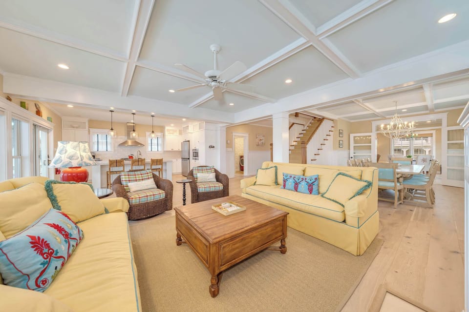 Relax in your elegant coastal living room after a day at the beach.