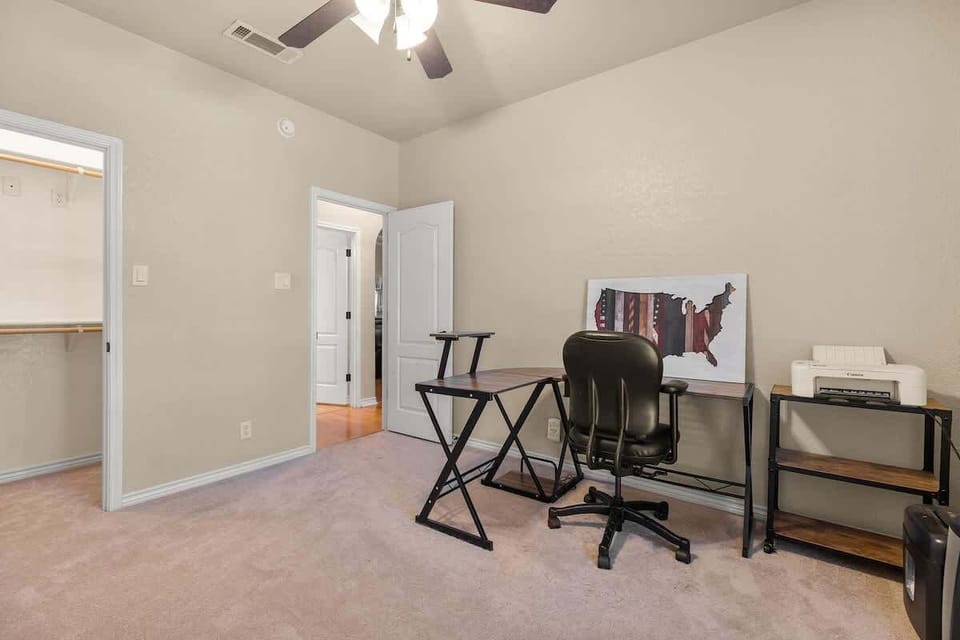 Flexible third bedroom featuring a twin daybed that easily converts to a king with 8” memory foam, along with a dedicated office space. Perfect for remote work, accommodating kids, or hosting extra guests in comfort.