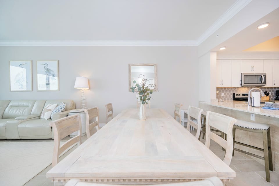 Dine at the spacious table surrounded by coastal decor and make lasting memories with family