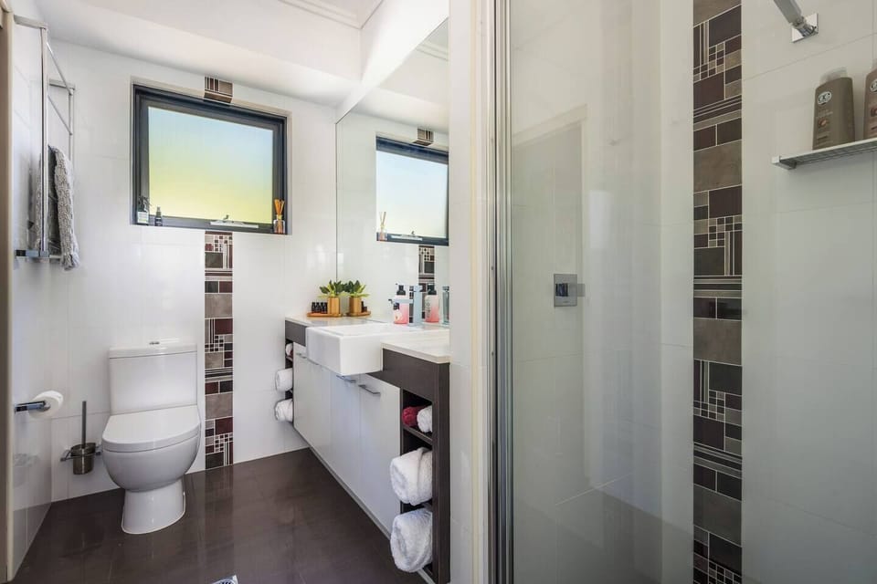 Refresh in the full bathroom featuring a shower, generous vanity, and complimentary toiletries.