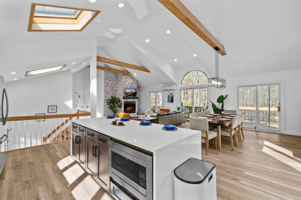 Cathedral ceilings, designer beams, and sunlight for days.