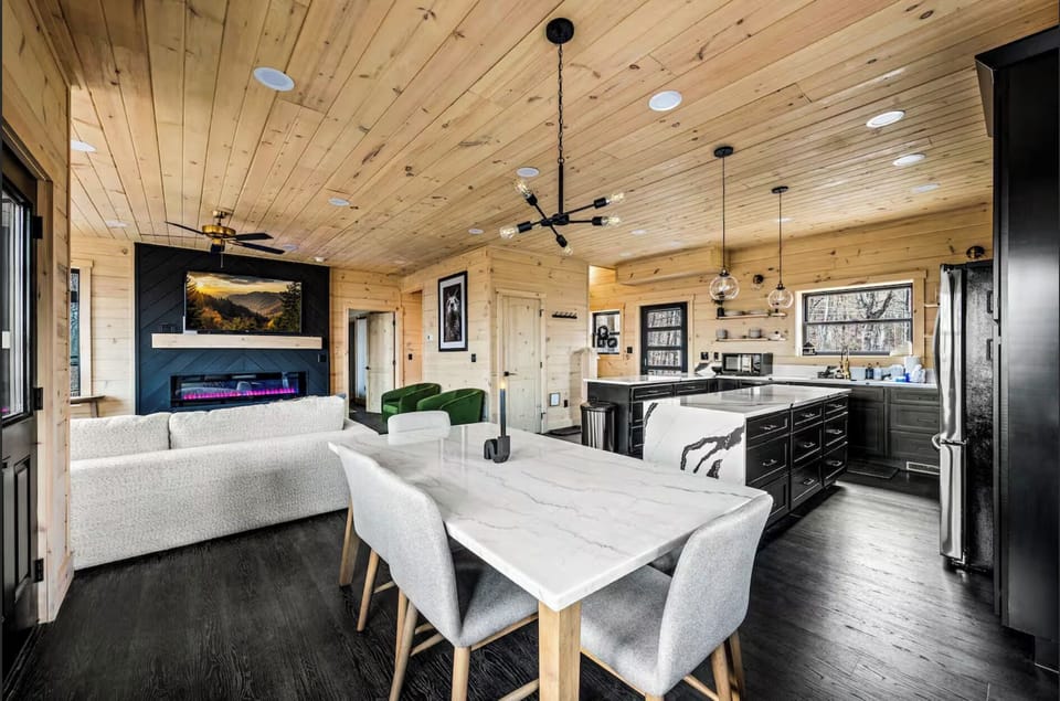 With an open floor plan, this cabin blends the kitchen, dining, and living areas