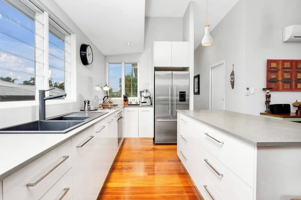 The gourmet kitchen includes state-of-the-art appliances to whip up a delicious meal, including a stove, oven, microwave, coffee maker and dishwasher for easy clean-up.
