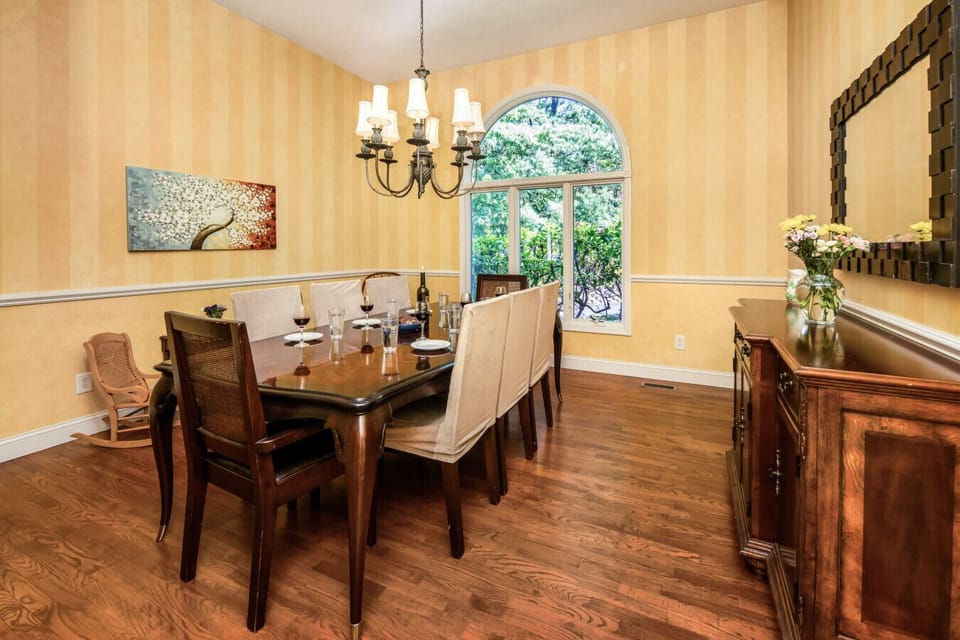 Formal Dining | Elegant Chandelier | Large Windows | Hardwood Floors