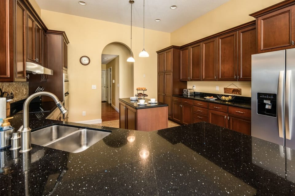 Kitchen | Spacious and fully equipped with modern appliances, granite countertops, and a center island for easy meal prep