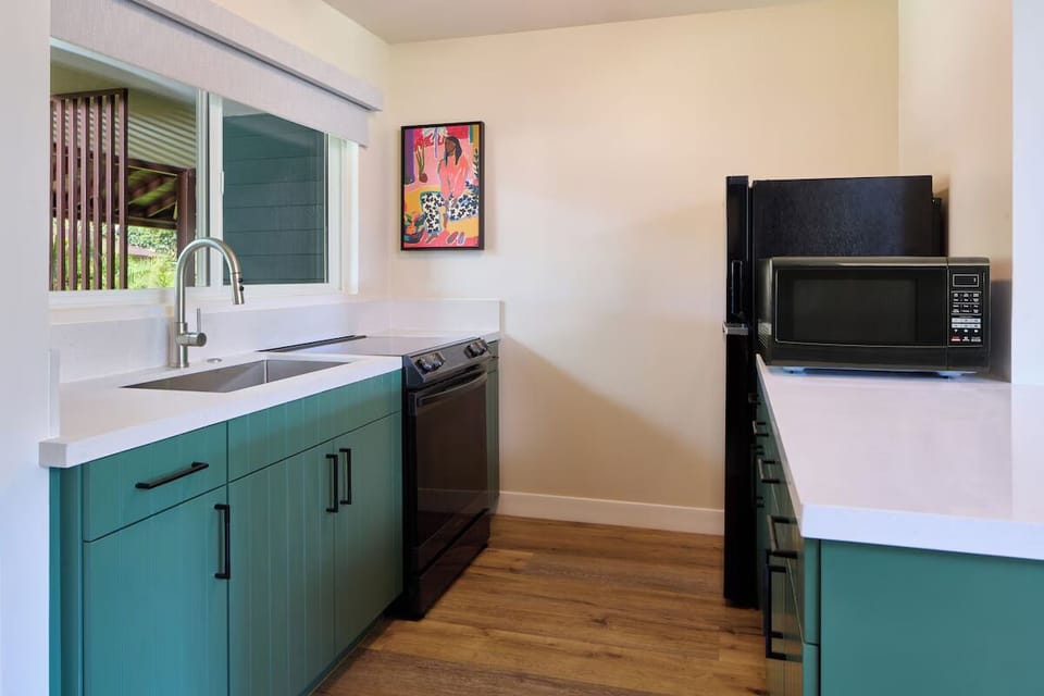 Cook effortlessly in a sleek kitchen with modern finishes.