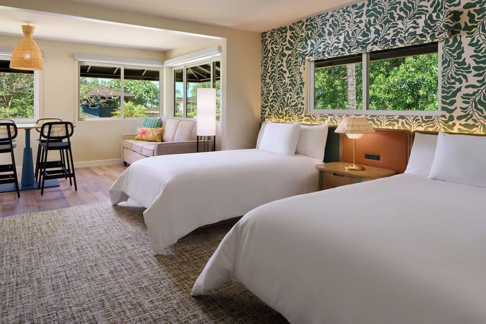 Unwind in bright twin beds with breezy island style.