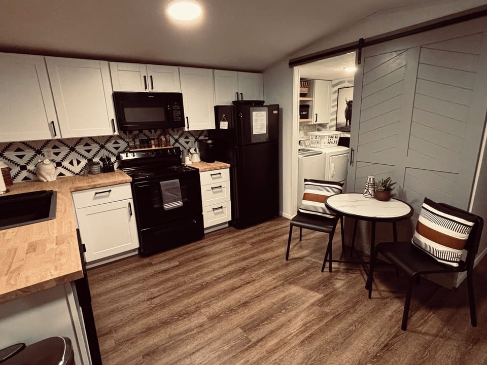 Fully stocked kitchen with pots & pans, baking dishes, and all the spices too!