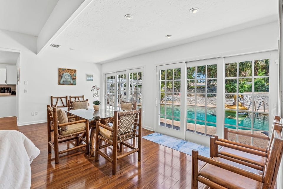 Sliding glass French doors leading to the private backyard