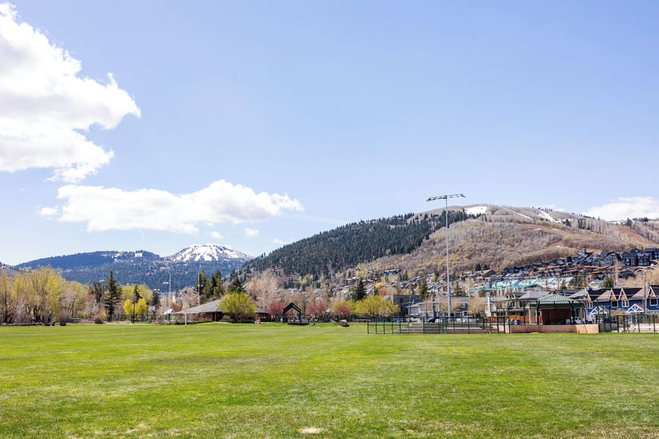 - Expansive green park with mountain backdrop  
- Perfect for outdoor activities and family fun  
- Scenic Park City rental near open recreation