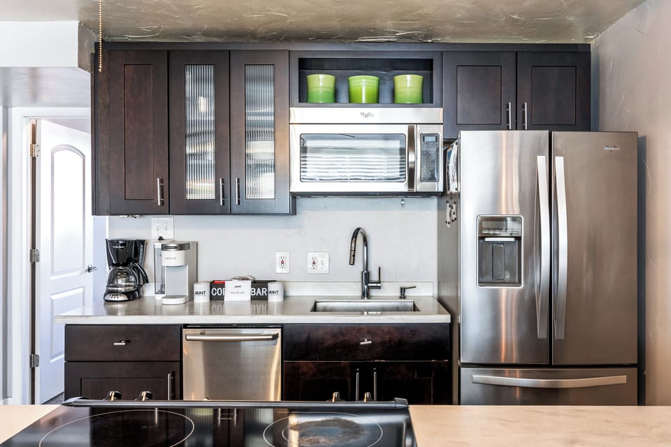 - Sleek kitchen with Whirlpool fridge and microwave  
- Coffee maker and Keurig for morning convenience  
- Park City rental with full kitchen and cookware