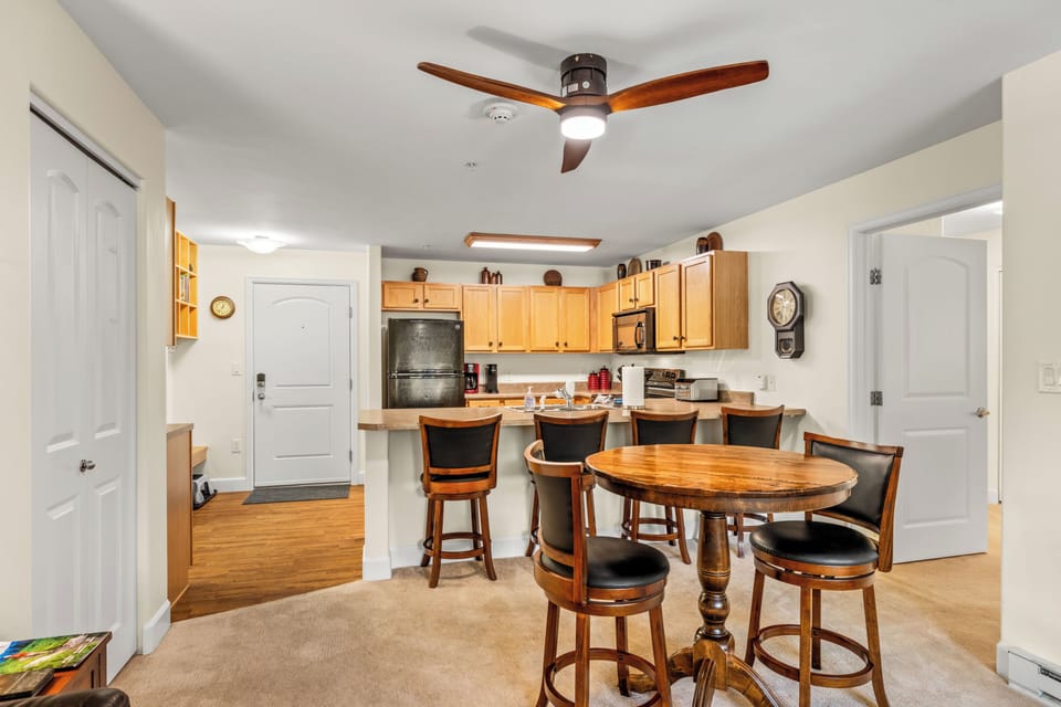 High top table for 2 and seating for 4 at the island.