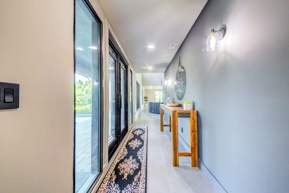 A bright, airy entrance opens into a spacious living space filled with natural light.