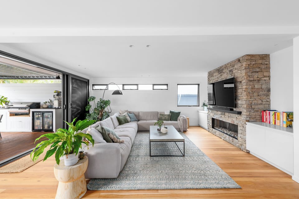 Main living area. 4m x 3m lounge and gas ignited fireplace. Smart tv.
