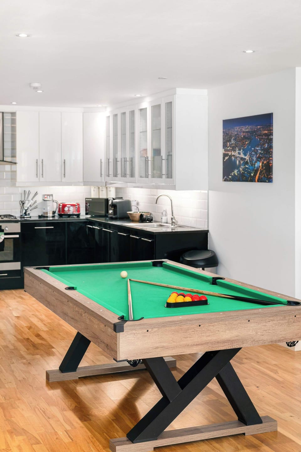 Where great stays become great memories—this spacious open-plan living, kitchen and dining area features a pool table, creating the perfect space to cook, connect, play and spend quality time together