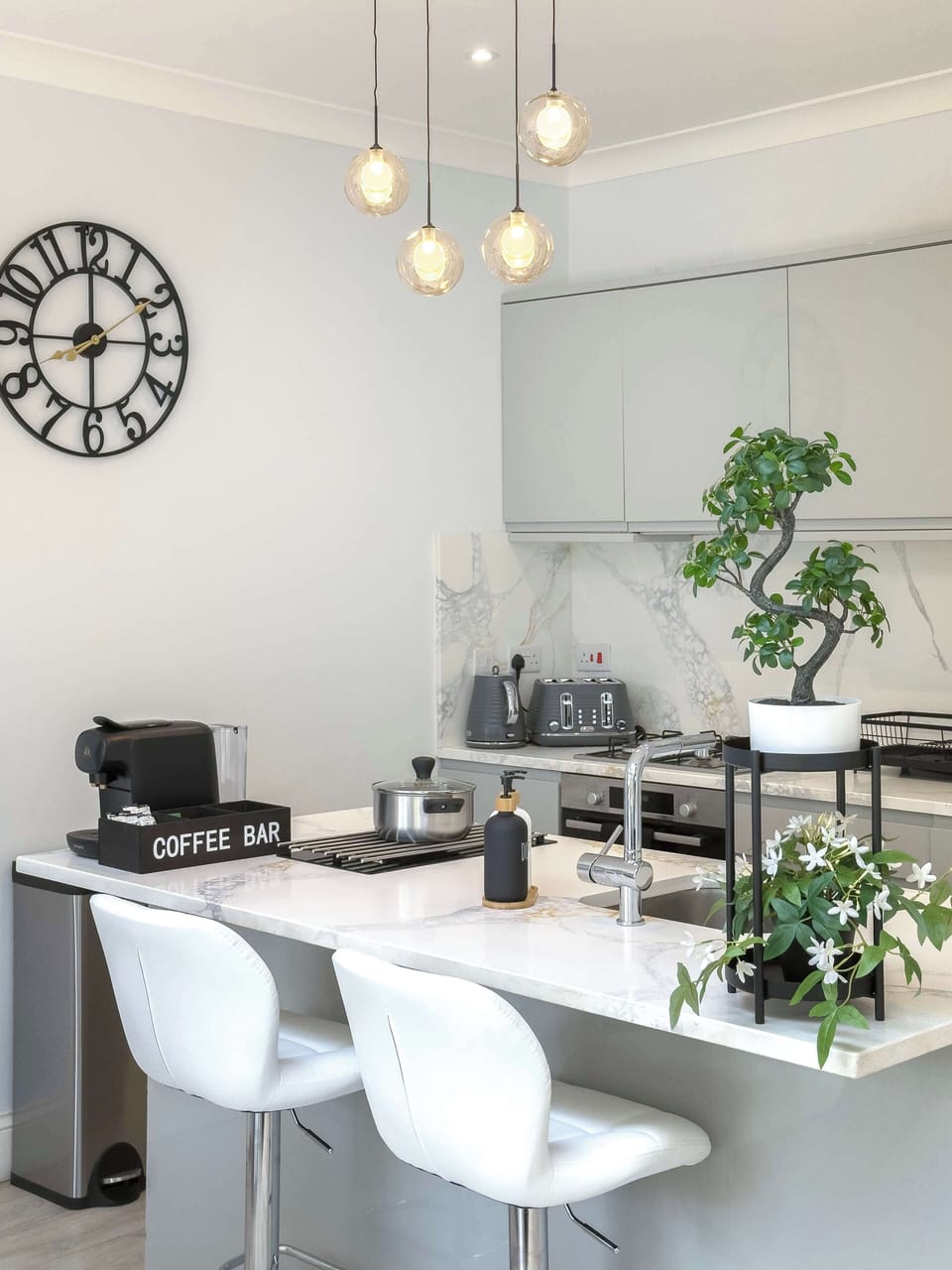 The stylish kitchen island with seating creates a welcoming space for casual dining, morning coffee or spending quality time together