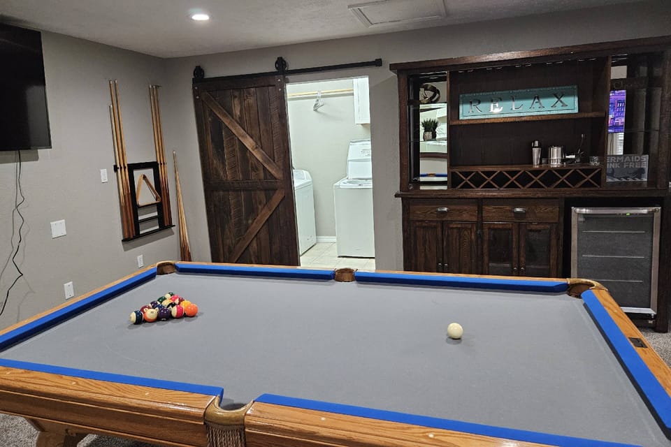 Game Room with Pool Table, and Fridge, and Games.