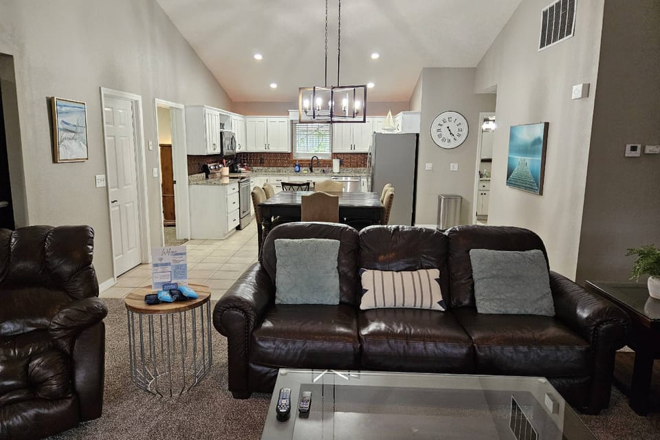 Living Room to Dining Room to Kitchen.