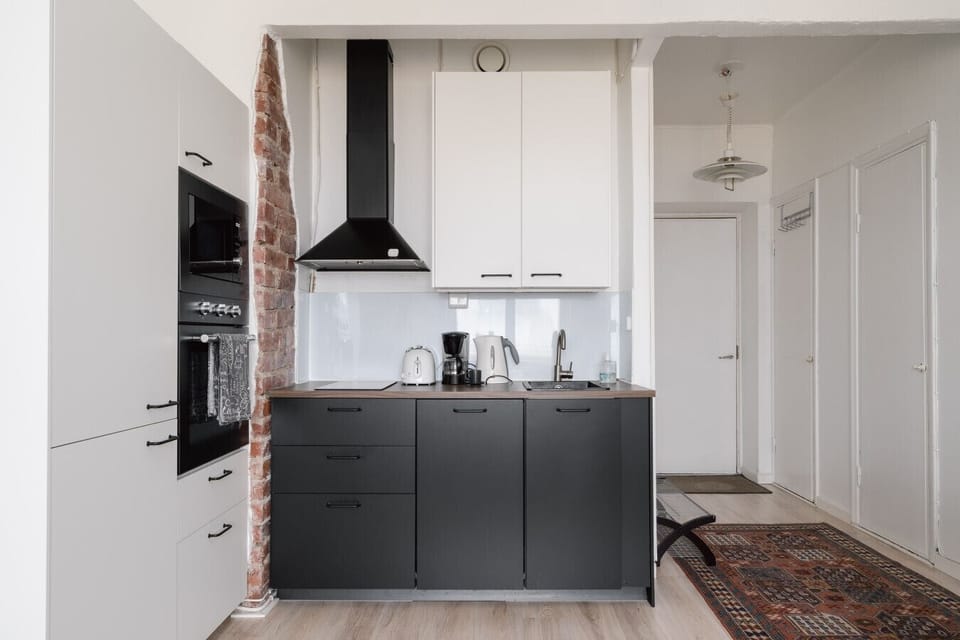 Sleek countertops and high-quality appliances make cooking here a pleasure.