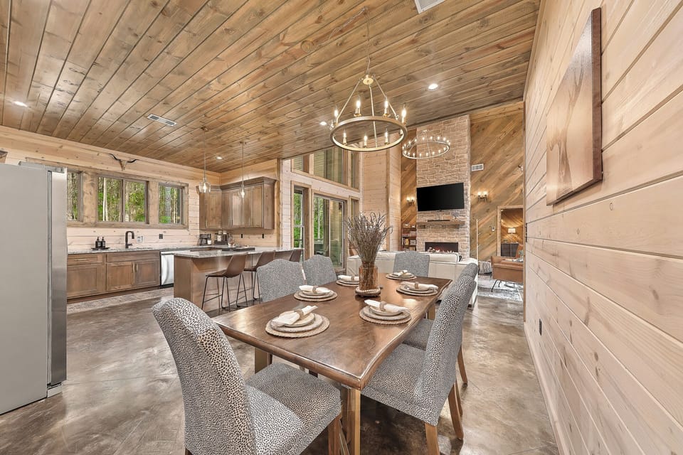 Dining table sits 6 and kitchen bar sits 3.