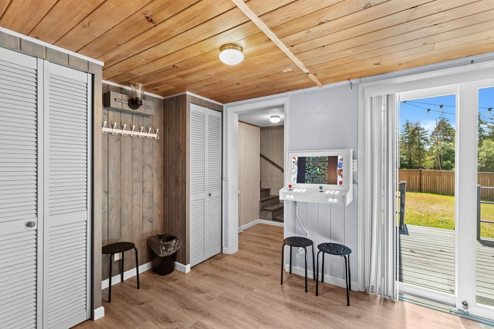 Arcade for entertainment and a convenient cloth hanger for added practicality.