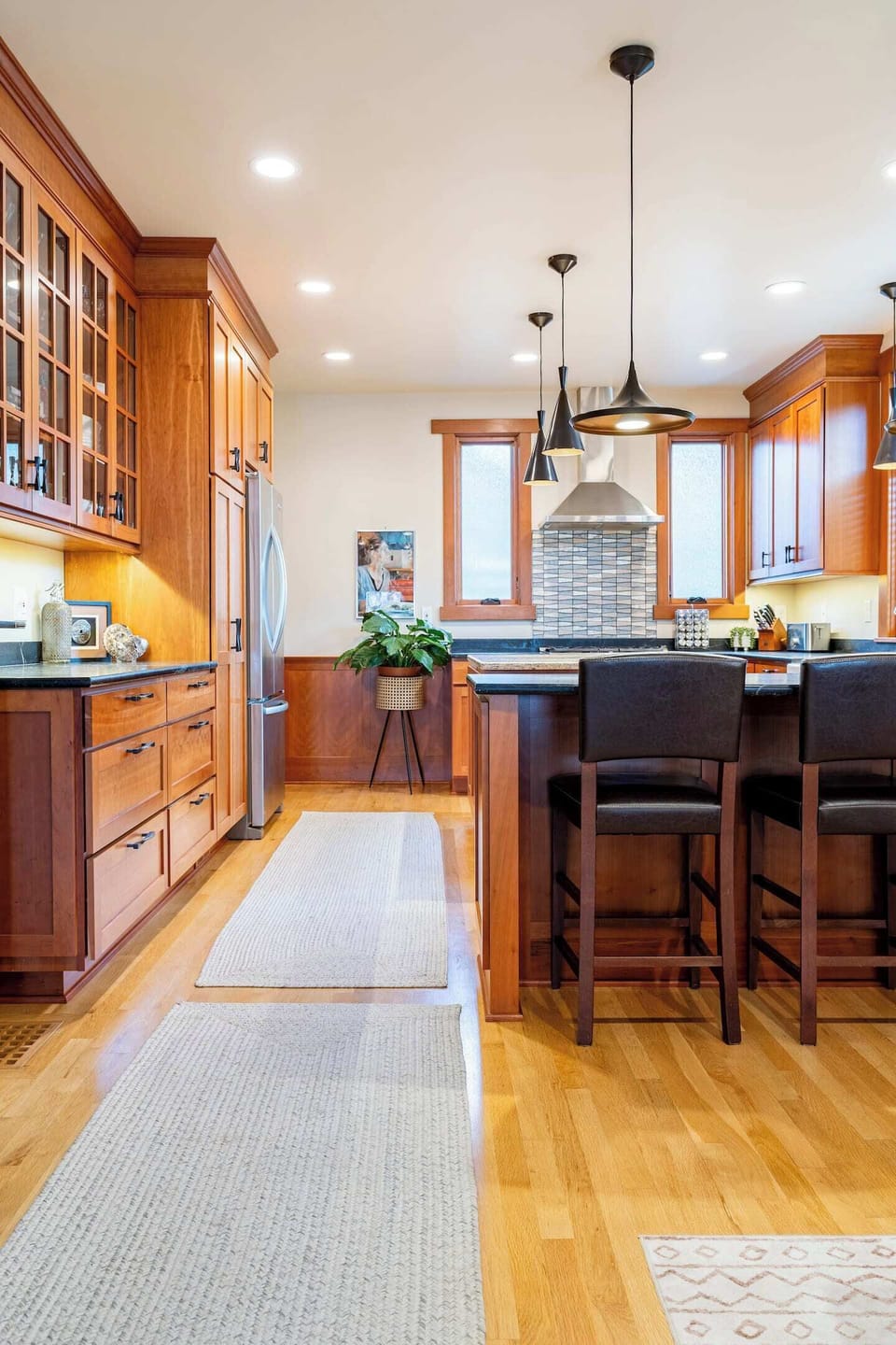 Kitchen has ample counter space & bar seating.