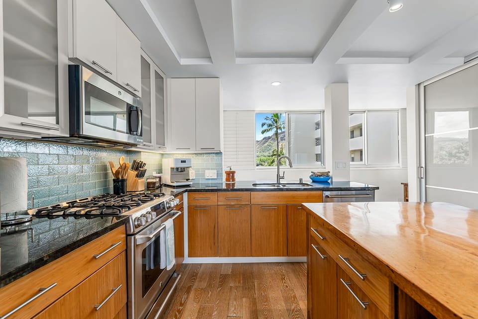 Bright, modern kitchen space with stainless steel appliances and sleek design.