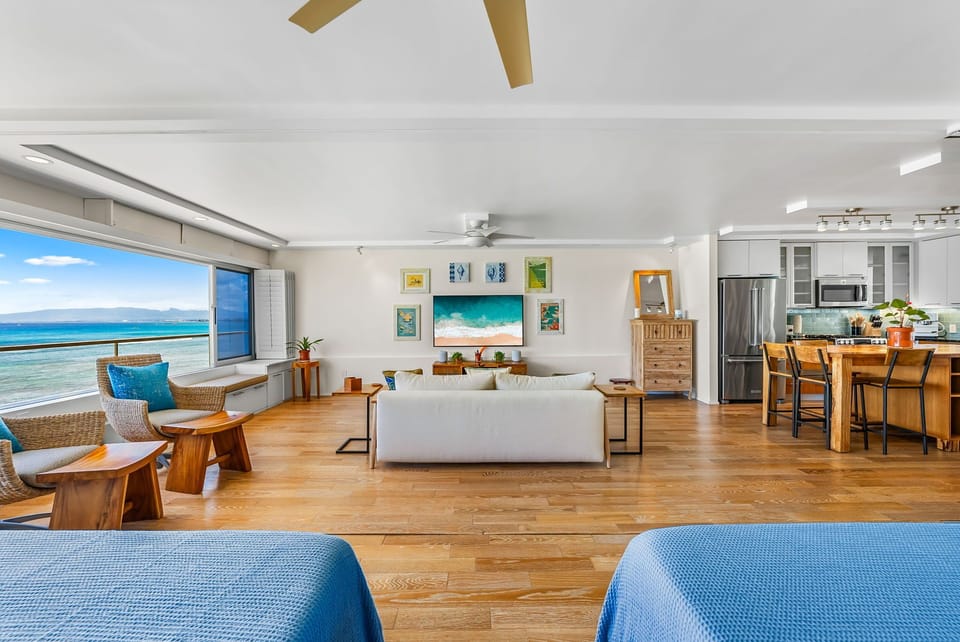 Open floor plan with coastal-chic design, inviting guests to unwind in a bright, breezy environment steps from the beach.