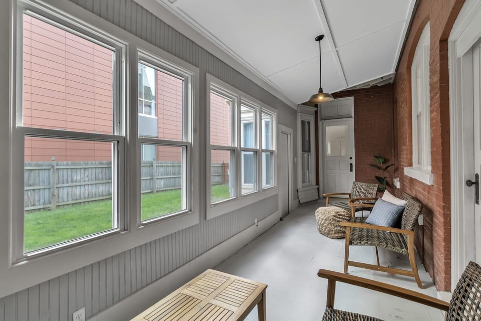 Enclosed porch facing the shared yard