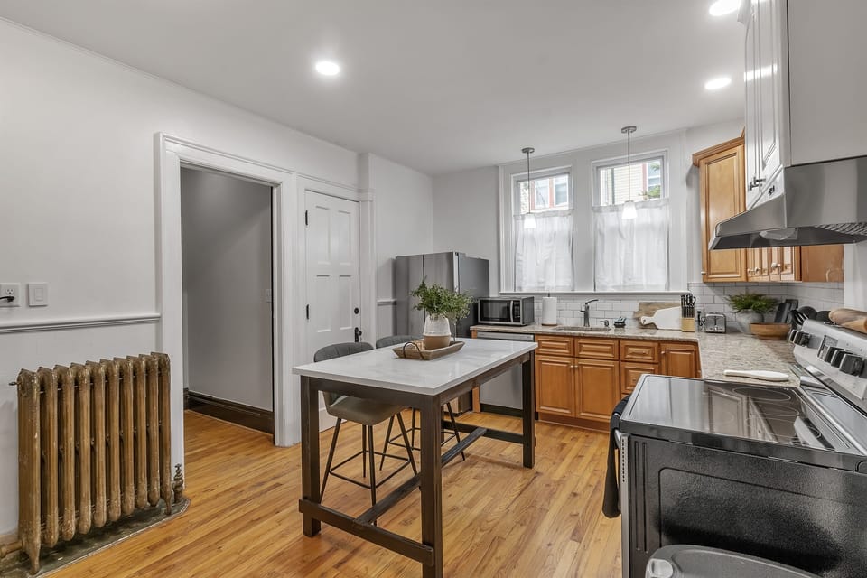 Even the kitchen has kitchen has original details like the scored plaster walls and cast iron radiator