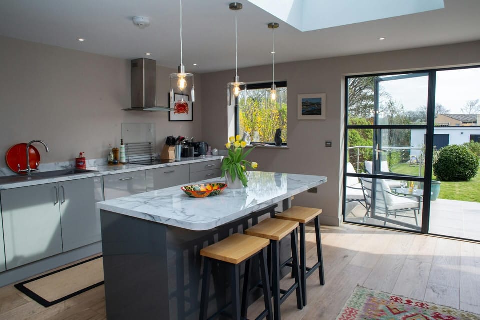 Kitchen with doors leading to terrace